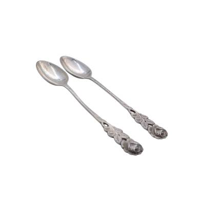SET DE DOUA LINGURITE PENTRU CEAI DIN ARGINT 800 CU ELEMENTE FLORALE 